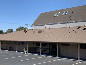 Low slope commercial roof and parking area