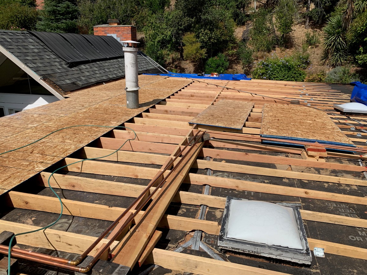 Exposed roof framing and decking during construction