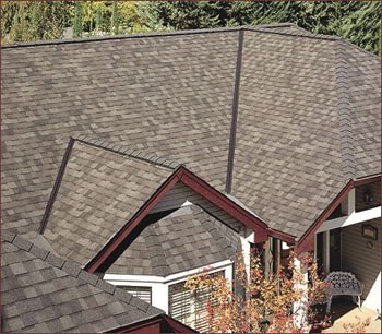Gray shingle roof with red-trimmed gables
